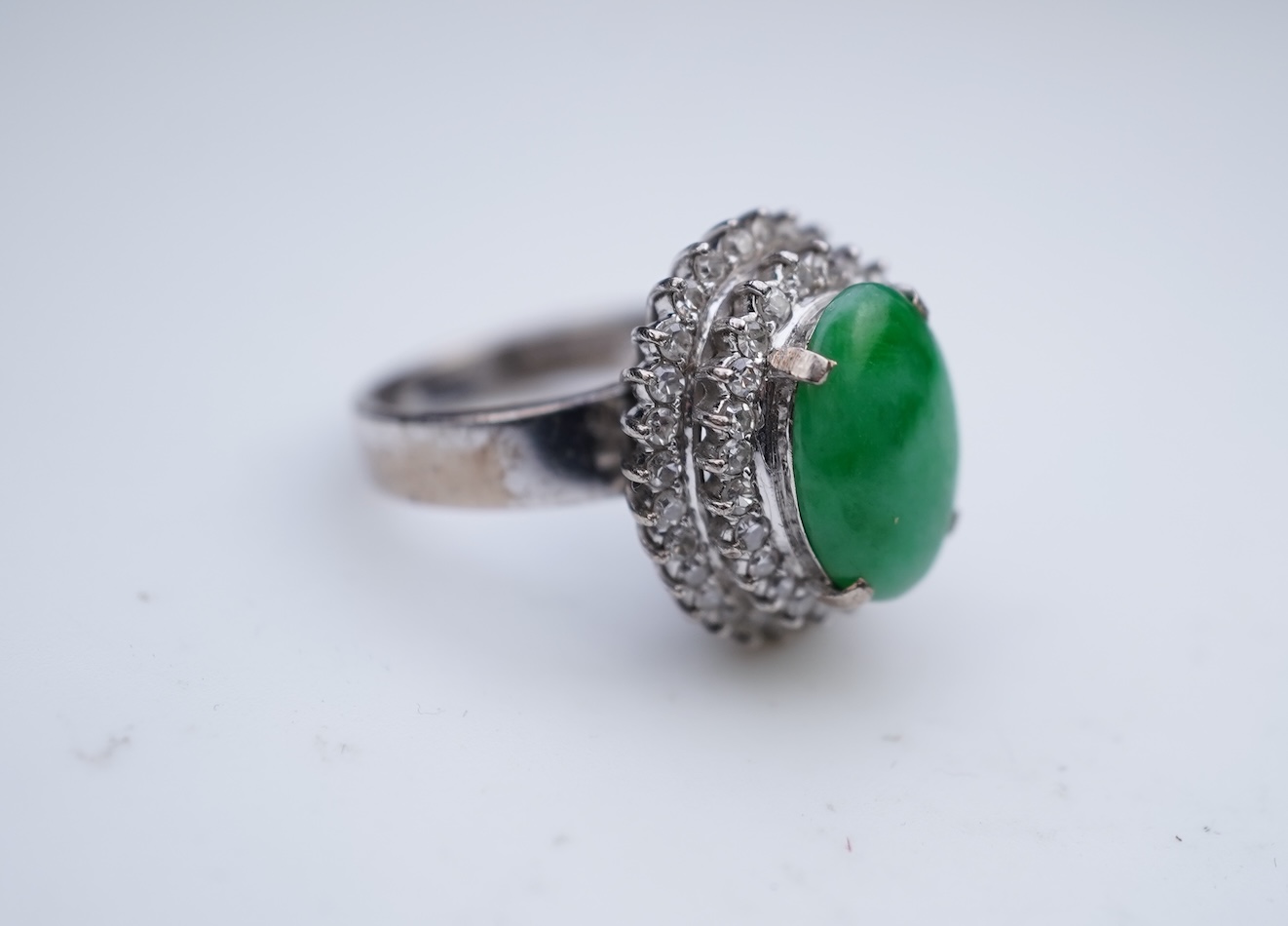 A jadeite and diamond ring